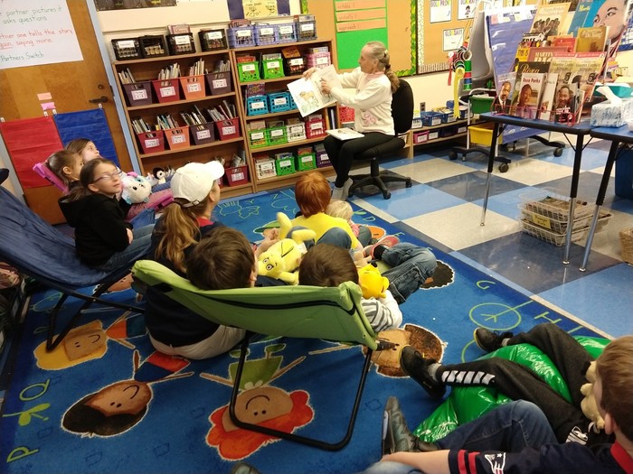 Dona Lee Ayer reads to second grade for the "Read to Me Challenge".