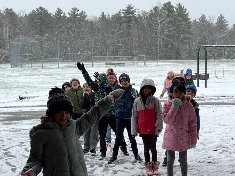 students celebrating the first snow outside 