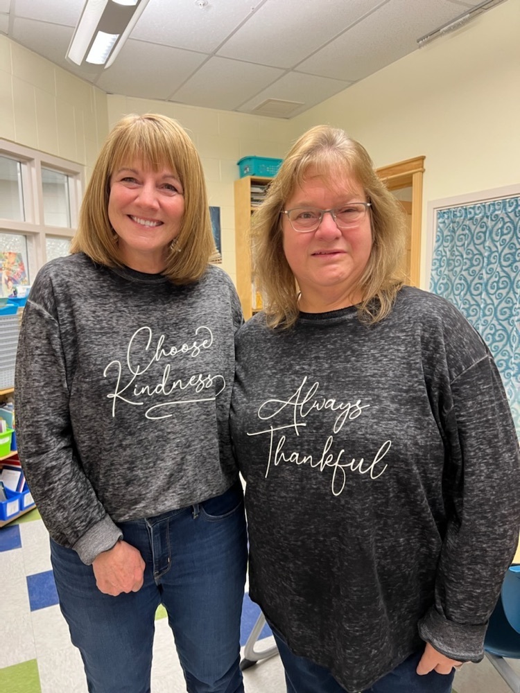 two staff members wearing Choose Kindness and Always Thankful shirts 