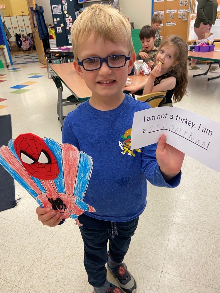 Kindergartener with turkey picture disguised as Spiderman 