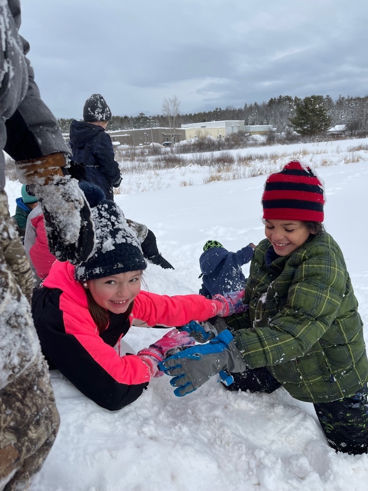 students building a snowfort