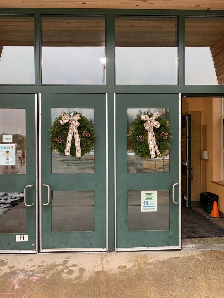 OTES front entrance with wreaths hung on the doors
