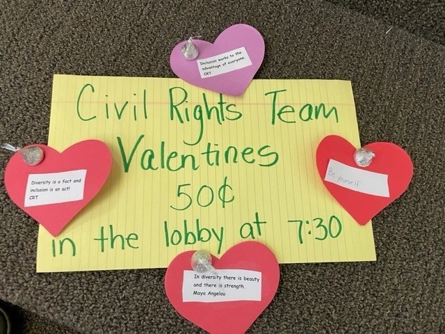 Civil Rights Team Valentines 50 cents in the lobby at 7:30, sign with heart cutouts and Hershey's kisses