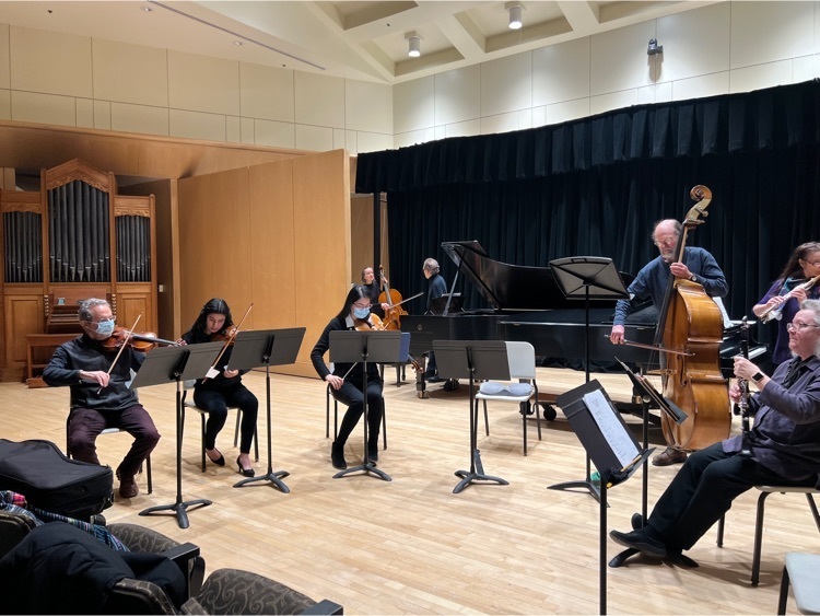 UMaine professors and students play instruments in a perfirmance
