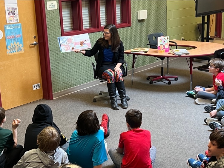 middle school librarian reading to students